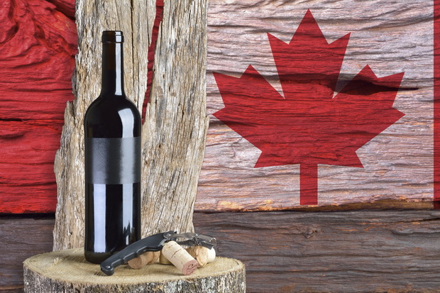 bottle of wine with Canada flag in the background