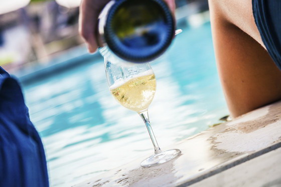 summer pool side pouring wine 560.jpg